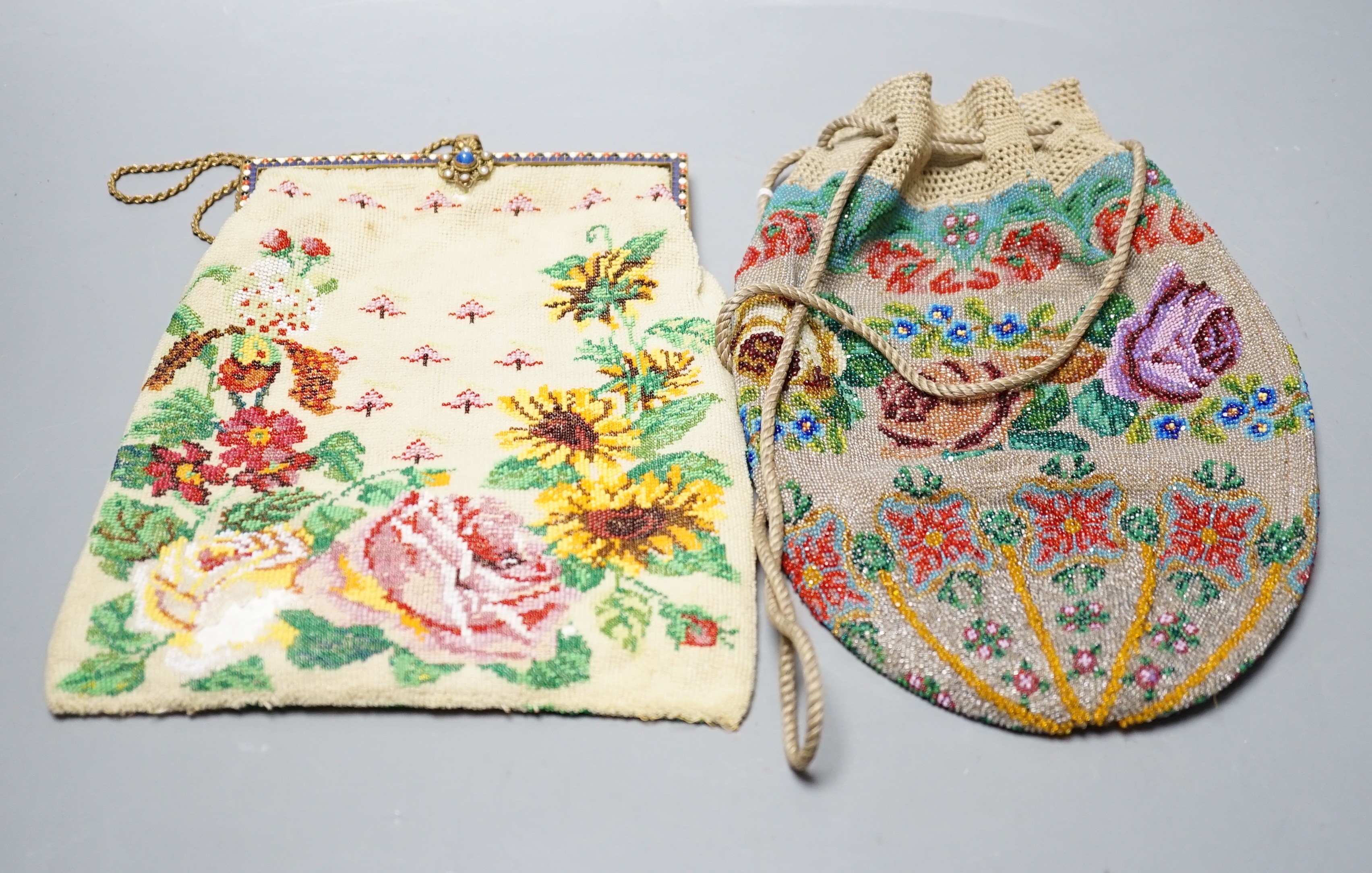 A 19th century framed beaded bag, designed with roses and garden flowers and another similar floral beaded drawstring bag, framed bead bag 21.5 cms high including clasp